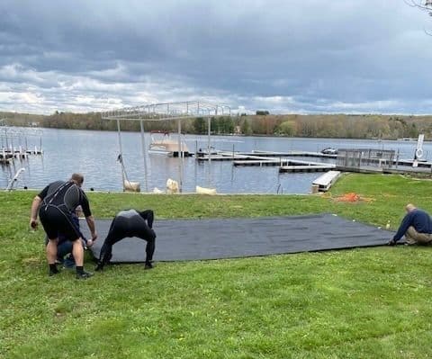 camp-members-assemble-mats.jpeg